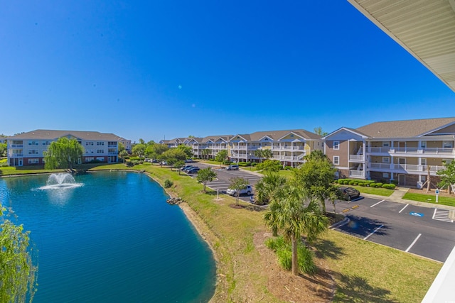 aerial view with a water view and a residential view