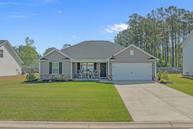 view of front of home featuring a garage, fence, a front yard, a porch, and driveway