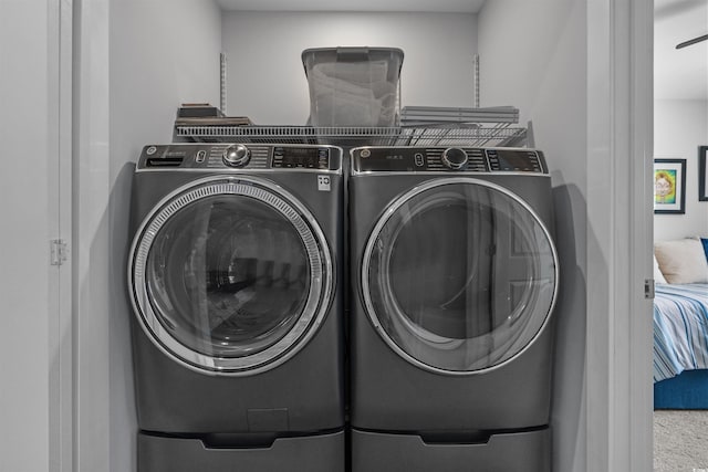 washroom with laundry area and independent washer and dryer