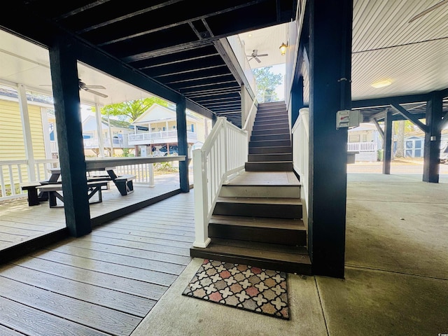 6001-1322 S Kings Hwy, Myrtle Beach, SC 29575 - staircase featuring healthy amount of natural light, a ceiling fan, and floor to ceiling windows