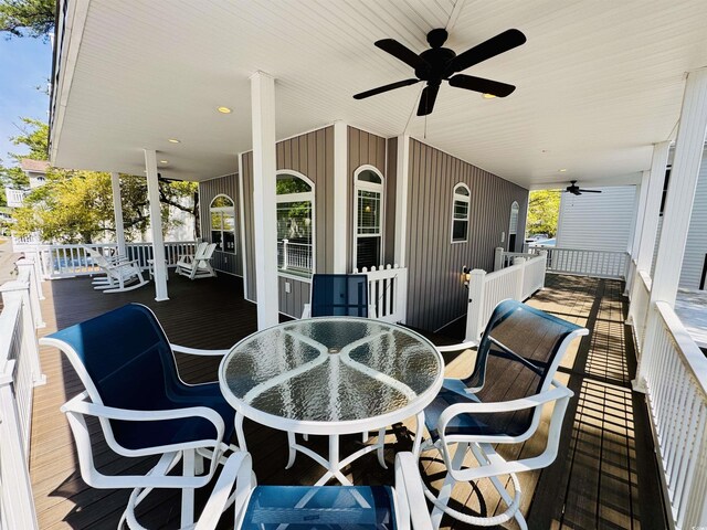 6001-1322 S Kings Hwy, Myrtle Beach, SC 29575 - covered porch with a ceiling fan and outdoor dining space