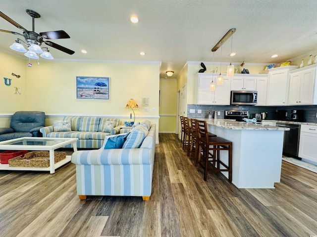 6001-1322 S Kings Hwy, Myrtle Beach, SC 29575 - living area with a ceiling fan, dark wood finished floors, ornamental molding, and recessed lighting
