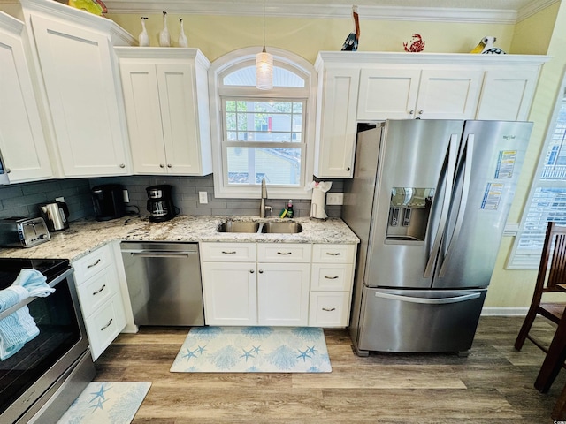 6001-1322 S Kings Hwy, Myrtle Beach, SC 29575 - kitchen with appliances with stainless steel finishes, a sink, white cabinetry, wood finished floors, and ornamental molding