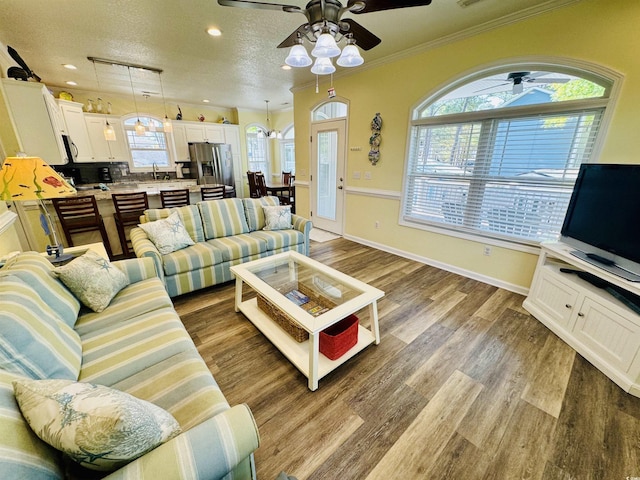 6001-1322 S Kings Hwy, Myrtle Beach, SC 29575 - living area featuring a ceiling fan, crown molding, wood finished floors, recessed lighting, and baseboards