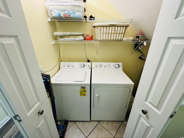 6001-1322 S Kings Hwy, Myrtle Beach, SC 29575 - laundry area featuring washing machine and dryer and light tile patterned flooring