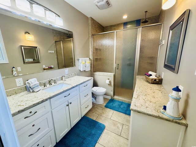 6001-1322 S Kings Hwy, Myrtle Beach, SC 29575 - bathroom with vanity, a stall shower, toilet, and tile patterned flooring