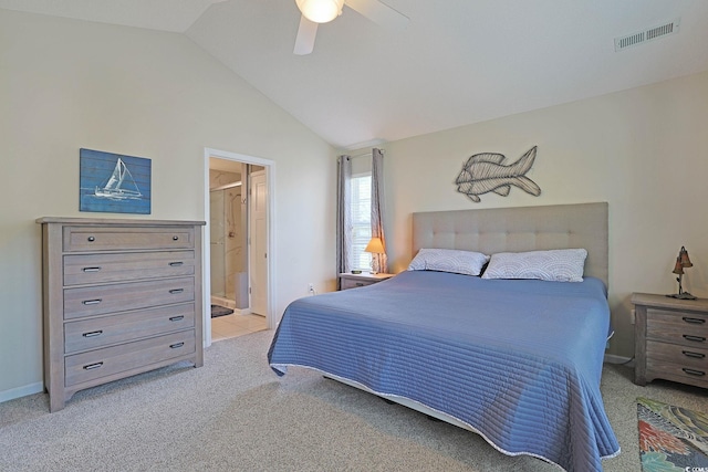 bedroom with light carpet, vaulted ceiling, visible vents, ceiling fan, and connected bathroom