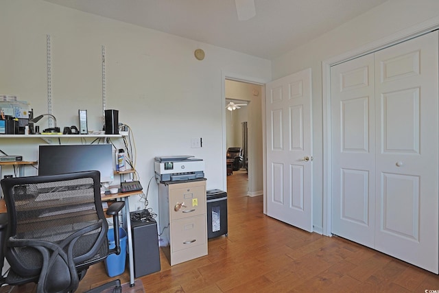 office space featuring ceiling fan and wood finished floors