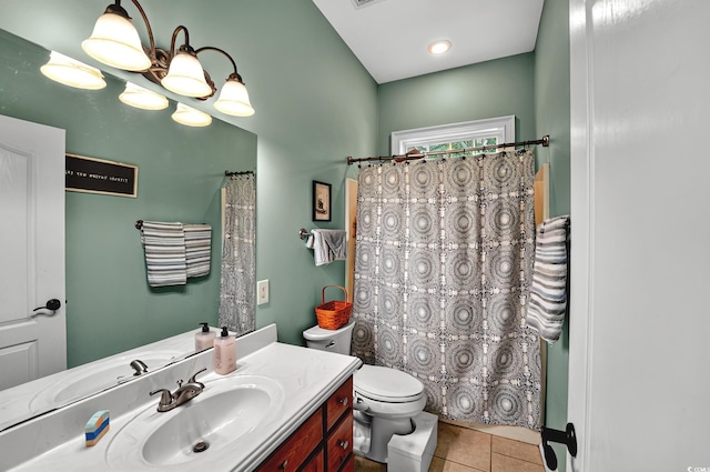 bathroom with vanity, toilet, a shower with shower curtain, and tile patterned flooring