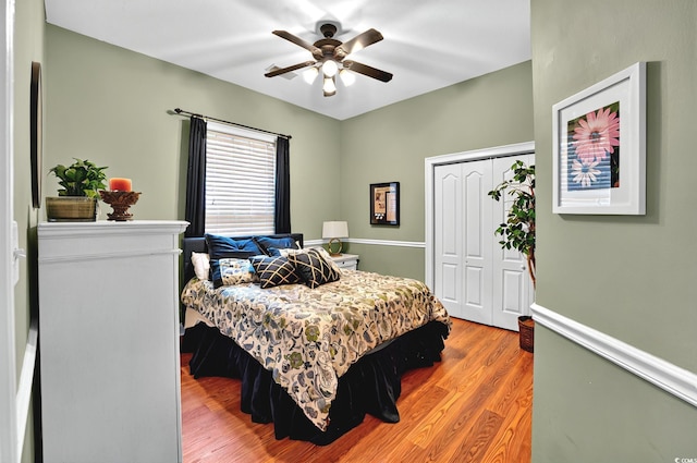 bedroom featuring a closet, ceiling fan, and wood finished floors