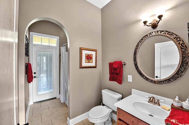 full bathroom with a shower with curtain, baseboards, toilet, tile patterned floors, and vanity