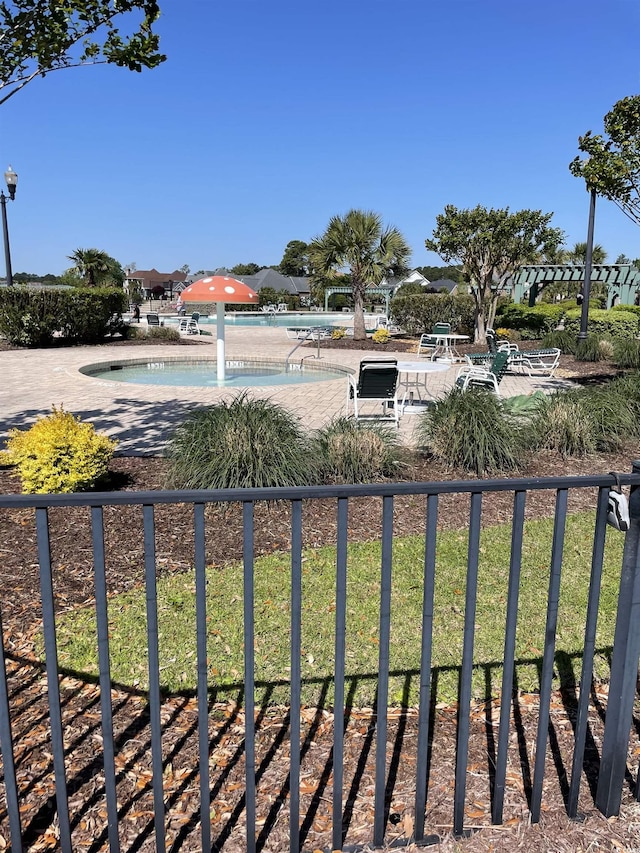 view of yard with a community pool and a patio area