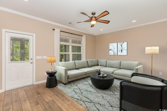 177 Olde Towne Way Unit 4, Myrtle Beach, SC 29588 - living area featuring wood finished floors, a healthy amount of sunlight, ornamental molding, and ceiling fan