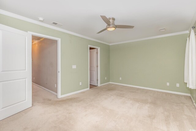 177 Olde Towne Way Unit 4, Myrtle Beach, SC 29588 - unfurnished bedroom featuring light colored carpet, baseboards, ornamental molding, and a walk in closet