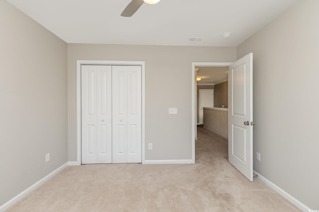 177 Olde Towne Way Unit 4, Myrtle Beach, SC 29588 - unfurnished bedroom featuring ceiling fan, a closet, baseboards, and light carpet