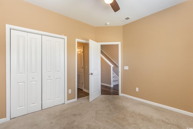 177 Olde Towne Way Unit 4, Myrtle Beach, SC 29588 - unfurnished bedroom featuring visible vents, a ceiling fan, a closet, baseboards, and carpet flooring