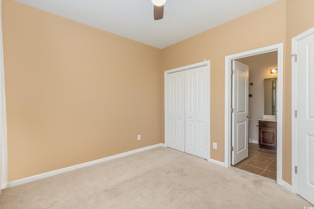 177 Olde Towne Way Unit 4, Myrtle Beach, SC 29588 - unfurnished bedroom featuring connected bathroom, a closet, baseboards, carpet flooring, and ceiling fan