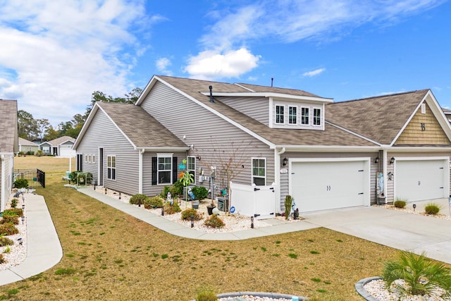 328 Logan St, Little River, SC 29566 - view of front of home with fence, roof with shingles, driveway, and a front yard