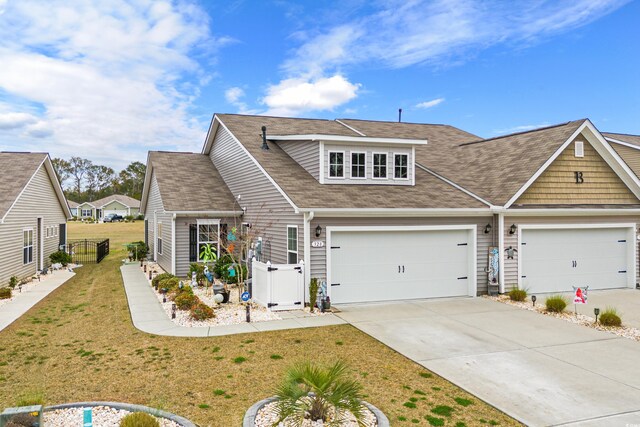 328 Logan St, Little River, SC 29566 - view of front of property with fence, a front lawn, concrete driveway, and roof with shingles