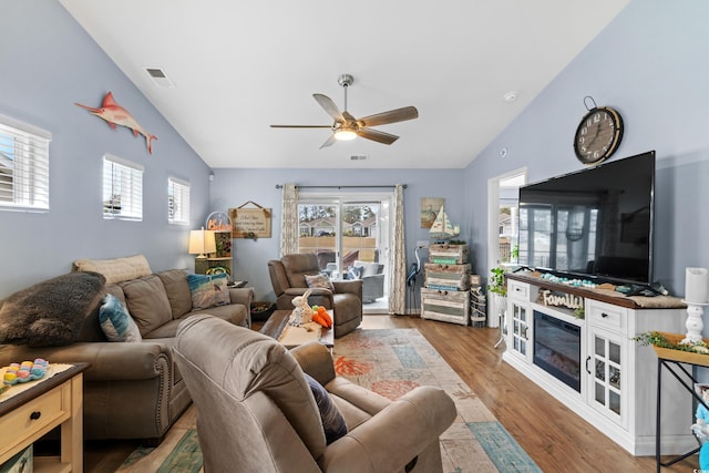328 Logan St, Little River, SC 29566 - living area with visible vents, wood finished floors, ceiling fan, and vaulted ceiling