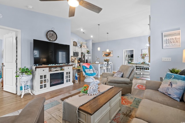328 Logan St, Little River, SC 29566 - living room with lofted ceiling, a ceiling fan, and light wood finished floors
