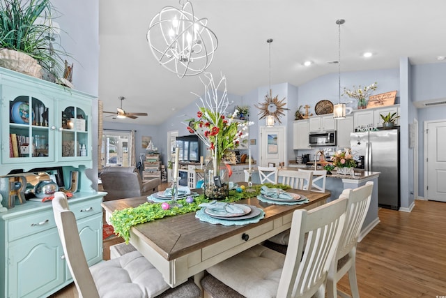 328 Logan St, Little River, SC 29566 - dining room featuring recessed lighting, high vaulted ceiling, visible vents, light wood-style flooring, and ceiling fan with notable chandelier
