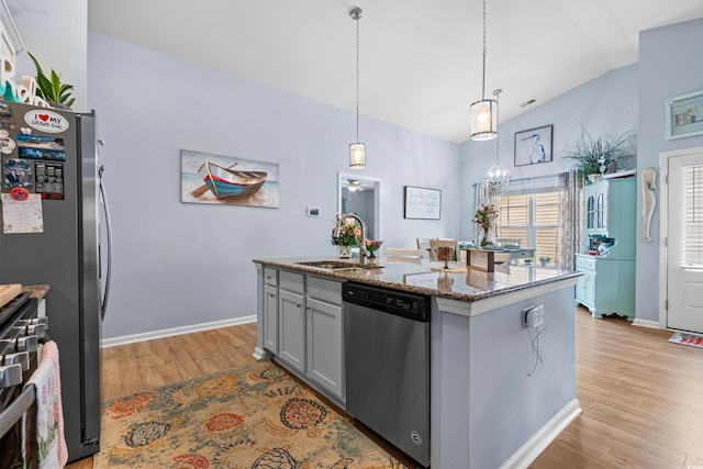 328 Logan St, Little River, SC 29566 - kitchen featuring a sink, stainless steel appliances, light wood-type flooring, stone counters, and lofted ceiling
