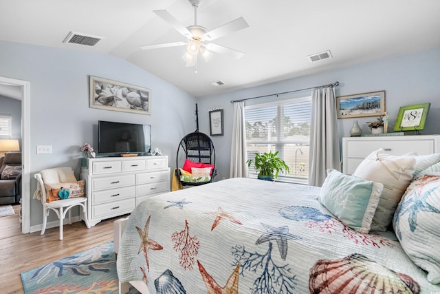 328 Logan St, Little River, SC 29566 - bedroom featuring visible vents, wood finished floors, and vaulted ceiling