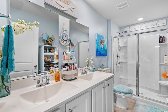 328 Logan St, Little River, SC 29566 - bathroom with a shower stall, toilet, double vanity, and a sink