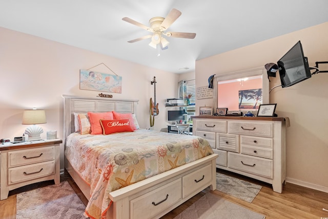 328 Logan St, Little River, SC 29566 - bedroom with light wood finished floors, a ceiling fan, and baseboards