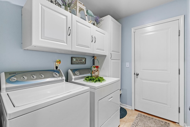 328 Logan St, Little River, SC 29566 - clothes washing area with light tile patterned floors, washing machine and dryer, and cabinet space