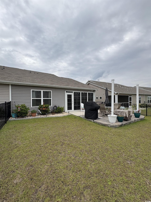 328 Logan St, Little River, SC 29566 - rear view of house featuring a patio, fence, and a yard