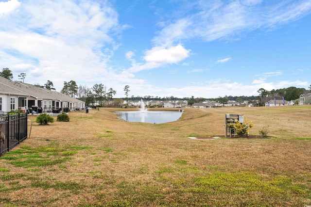 328 Logan St, Little River, SC 29566 - view of yard featuring a water view and fence