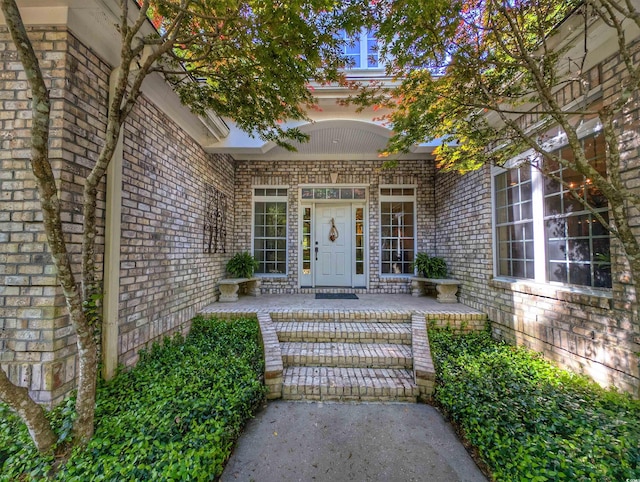 710 Masters Dr, Pawleys Island, SC 29585 - property entrance with brick siding and covered porch