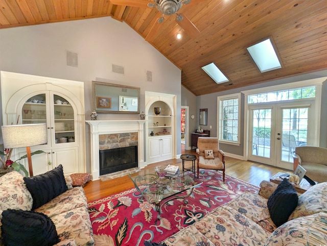 710 Masters Dr, Pawleys Island, SC 29585 - living room with a fireplace, wood finished floors, visible vents, and high vaulted ceiling