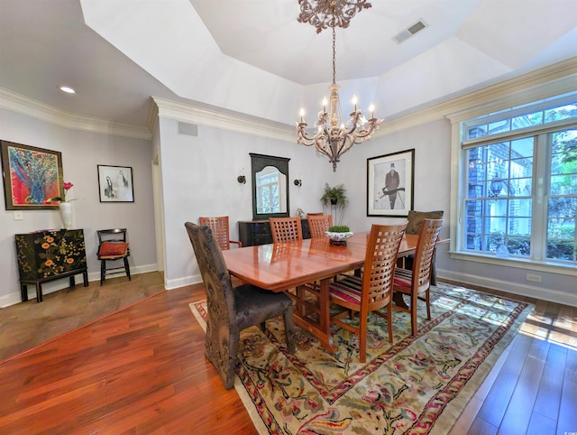 710 Masters Dr, Pawleys Island, SC 29585 - dining area with an inviting chandelier, crown molding, wood finished floors, and visible vents