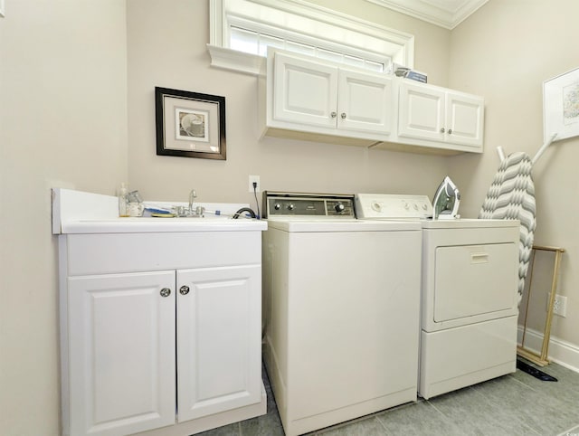 710 Masters Dr, Pawleys Island, SC 29585 - clothes washing area with light tile patterned flooring, cabinet space, washing machine and dryer, baseboards, and ornamental molding