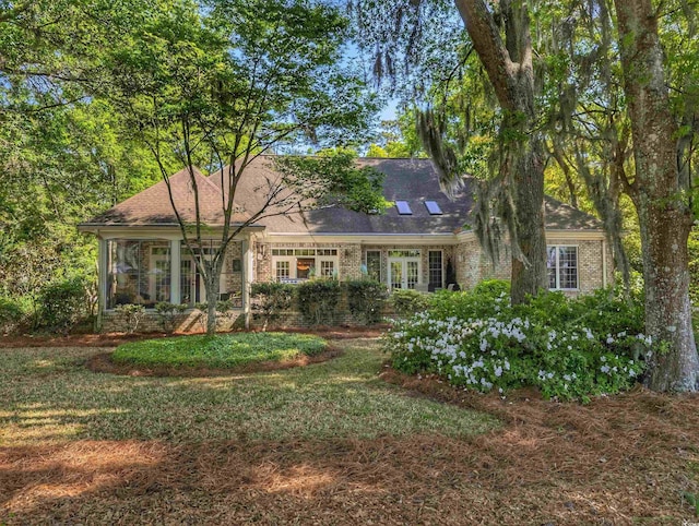 710 Masters Dr, Pawleys Island, SC 29585 - single story home with a shingled roof, brick siding, and a front yard