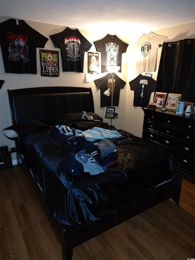 bedroom with wood finished floors