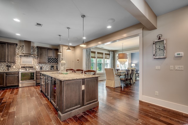 4964 Salt Creek Ct, North Myrtle Beach, SC 29582 - kitchen featuring stainless steel range, wall chimney exhaust hood, dark wood finished floors, dark brown cabinetry, and recessed lighting
