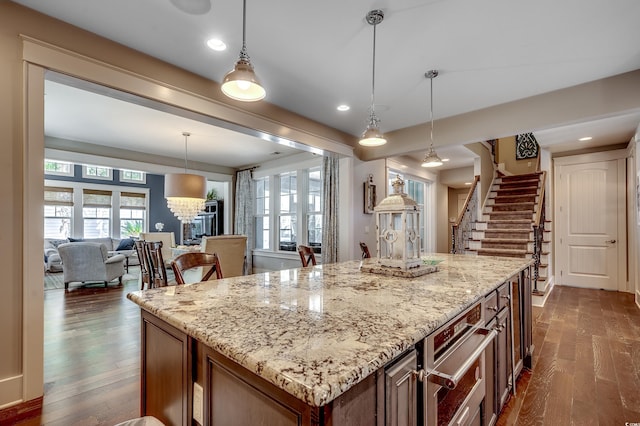 4964 Salt Creek Ct, North Myrtle Beach, SC 29582 - kitchen with dark wood-type flooring, plenty of natural light, light stone countertops, and recessed lighting