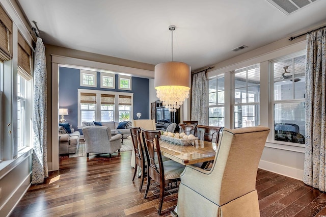 4964 Salt Creek Ct, North Myrtle Beach, SC 29582 - dining space featuring dark wood-type flooring and a chandelier