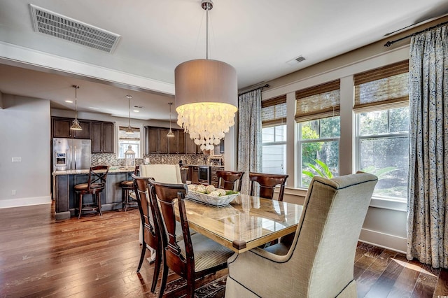 4964 Salt Creek Ct, North Myrtle Beach, SC 29582 - dining area with dark wood-type flooring and recessed lighting