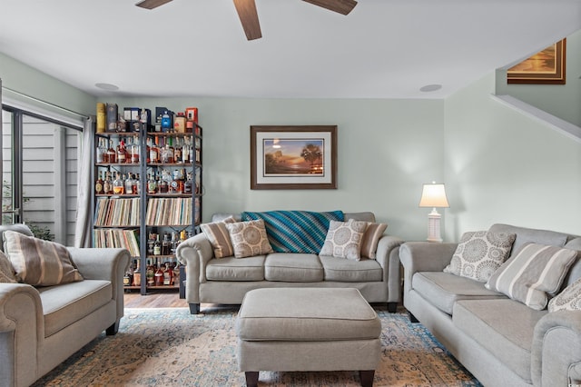 living area featuring ceiling fan and wood finished floors