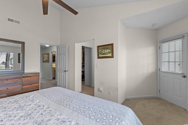 bedroom featuring beam ceiling, visible vents, baseboards, and carpet floors