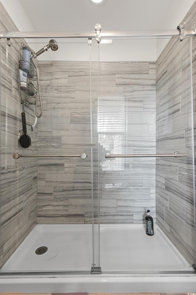 bathroom with a shower stall