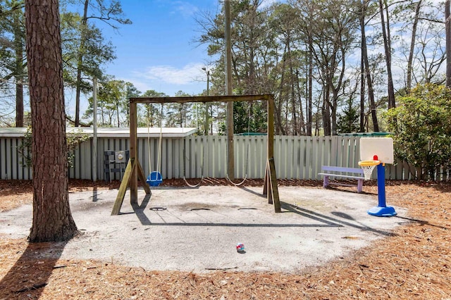 view of playground featuring fence