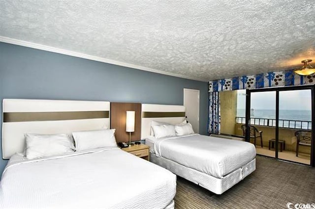 7100 N Ocean Blvd Unit 405, Myrtle Beach, SC 29572 - bedroom with access to exterior, crown molding, a water view, and a textured ceiling