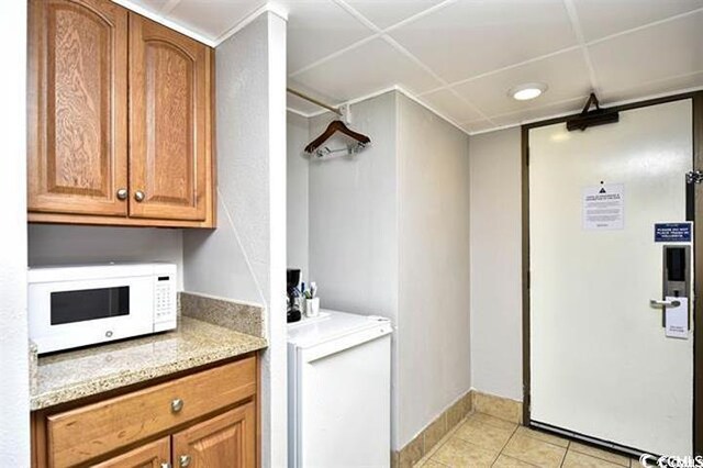 7100 N Ocean Blvd Unit 405, Myrtle Beach, SC 29572 - washroom featuring light tile patterned flooring and baseboards