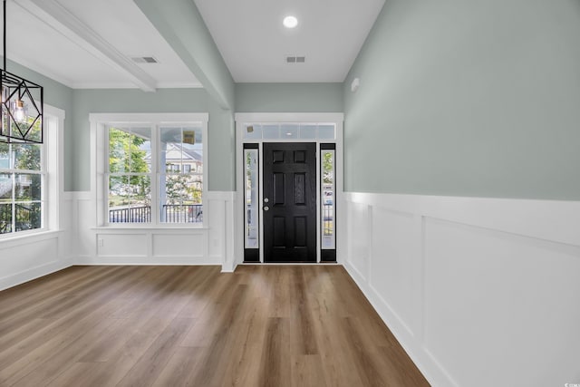 868 Crystal Water Way, Myrtle Beach, SC 29579 - foyer with wainscoting, wood finished floors, a decorative wall, and crown molding